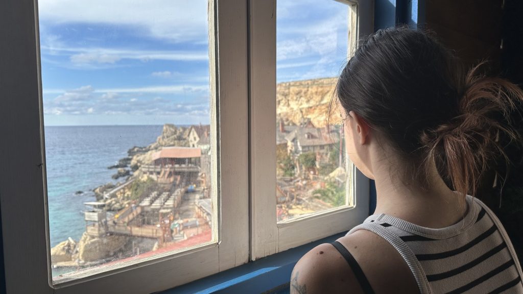 emma overlooking popeye village filming location in malta