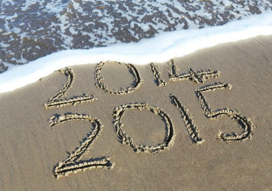 beach shore etch with 2014 and 2015 texts during daytime